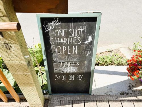 a chalkboard sign that says one shot chattel at Above the Shot Harrisons Gem in Harrison