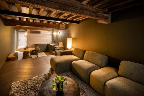 a living room with a couch and a table at Boutique Hotel Venlo in Venlo