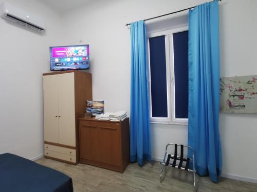 Μια τηλεόραση ή/και κέντρο ψυχαγωγίας στο B&B Al Faro di Barby