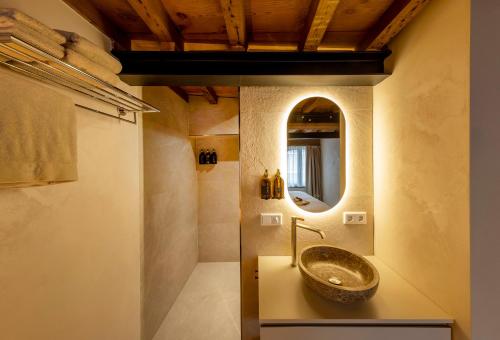 a bathroom with a sink and a mirror at Boutique Hotel Venlo in Venlo