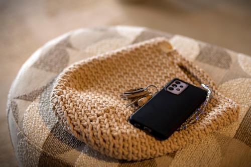 a cell phone in a purse with keys on it at Boutique Hotel Venlo in Venlo