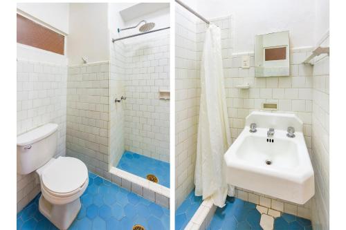 a bathroom with a white toilet and a sink at Capital O Hotel Del Parque Guadalajara in Guadalajara