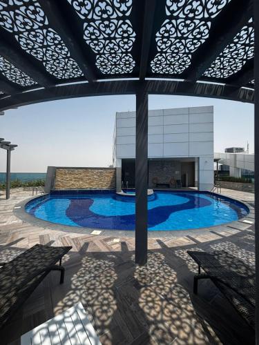 a swimming pool in the middle of a building at High Floor The Bay 16 floor by Khalifa & Canal Views in Dubai