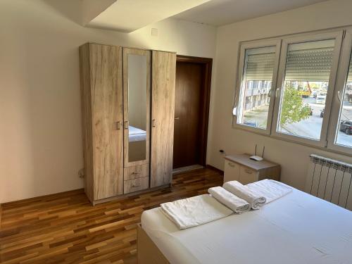 Postel nebo postele na pokoji v ubytování City Center Apartments