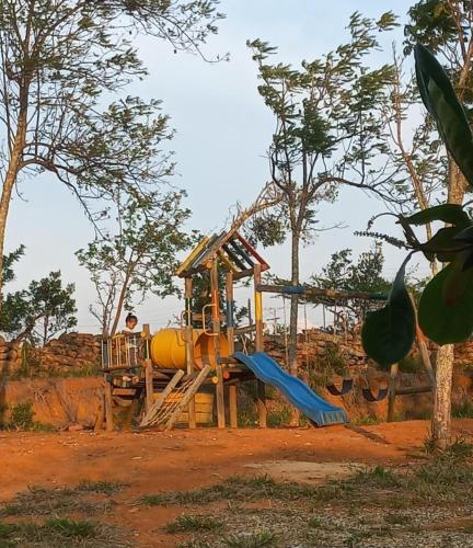 a playground with a slide in a park at San Rafael del Campo - Barichara in Barichara