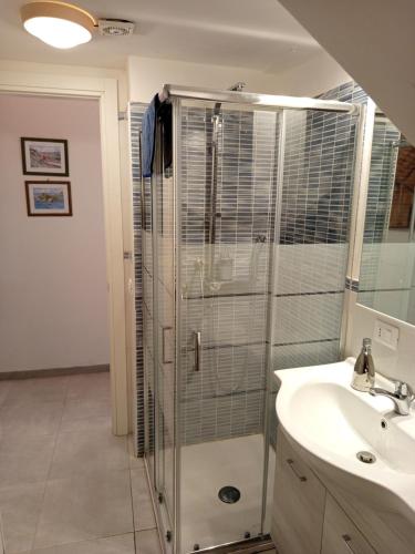 a bathroom with a shower and a sink at ToviMar Apartments in Taormina