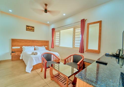 Voodi või voodid majutusasutuse Munnar Ice Pellets Resort with Pool by VOYE HOMES toas