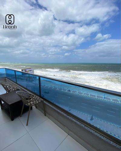 a balcony with a view of the ocean at Hayah Waterfalls Hotels in Alexandria