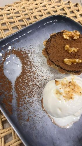 a plate of food with a piece of cake on it at Auka Boipeba in Ilha de Boipeba