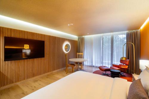 a hotel room with a bed and a tv on a wall at Camino Real Polanco Mexico in Mexico City