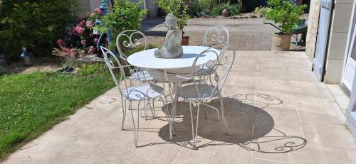 a table and chairs sitting on a patio at lacelledor in La Celle-Saint-Avant