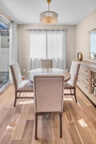a dining room with a table and chairs at Stylish 3br 3 Bth w fireplace in Beaumont