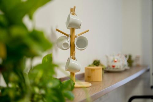 a wooden holder with mugs on a counter at NonnaLo' bed and breakfast in Verbicaro