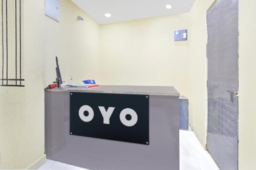 an ovo sign on a desk in a room at Hotel O HOLIDAY STAR IN in Hyderabad