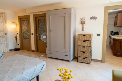 a bedroom with a bed and a room with a table at Agriturismo Casa del Vento in San Presto