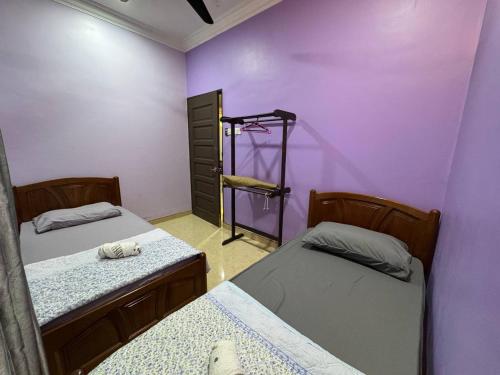 Ένα ή περισσότερα κρεβάτια σε δωμάτιο στο 63 Homestay