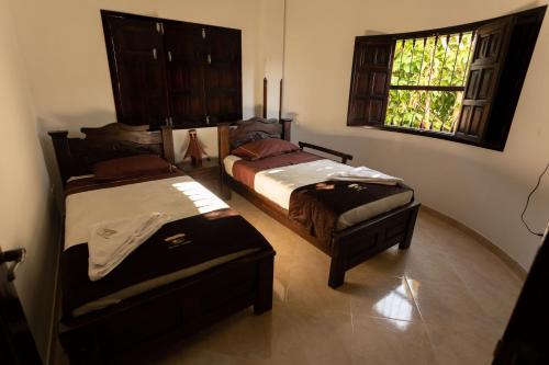 Cama o camas de una habitación en Condominio Parque Baviera