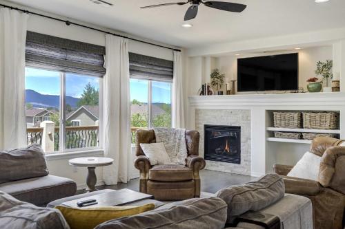 a living room with couches and a fireplace at Highpoint Hills Great Views w Games & Fitness in Colorado Springs