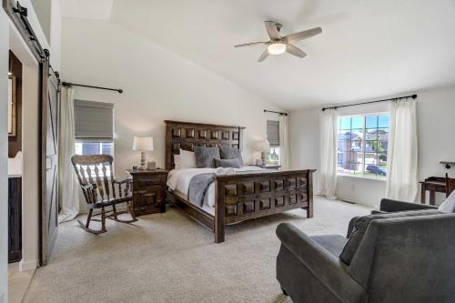 a bedroom with a bed and a ceiling fan at Highpoint Hills Great Views w Games & Fitness in Colorado Springs