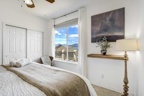 a bedroom with a bed and a window at Highpoint Hills Great Views w Games & Fitness in Colorado Springs