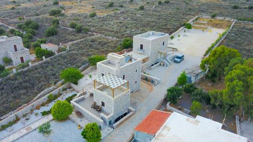 an aerial view of a large white building at Armenopetra View Gerolimenas in Gerolimenas