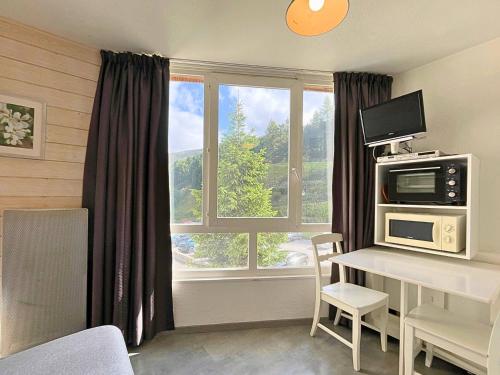 Charmant studio aux Ménuires pour 2, pied des pistes, proche commerces, équipements modernes
