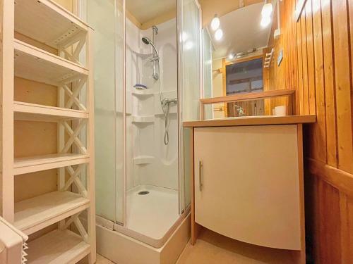 a bathroom with a shower and a walk in closet at Studio avec coin chambre, balcon, cuisine équipée, pied des pistes - Les Ménuires - FR-1-452-262 in Les Menuires