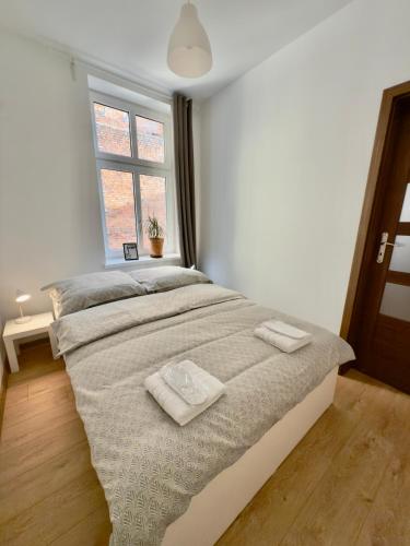 Ένα ή περισσότερα κρεβάτια σε δωμάτιο στο Apartament Stare Centrum