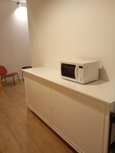 a microwave sitting on top of a counter at Numero 5 in Bari