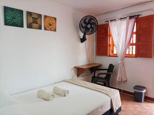 Ένα ή περισσότερα κρεβάτια σε δωμάτιο στο Petroglifo Room Támesis