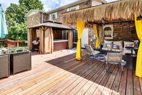 a wooden deck with a gazebo at Hidden Paradise on 5 Acres with Hot Tub and Deck! in Black Jack