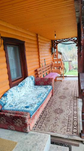 two beds sitting in the corner of a room at Садиба Трембіта in Pilipets