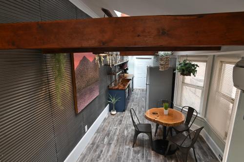 a kitchen and dining area of a tiny house at BurgBnB Downtown in Harrisburg