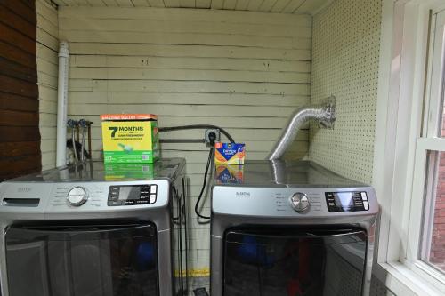 a kitchen with two microwaves and a sink at BurgBnB Downtown in Harrisburg