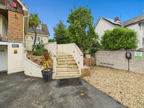 a set of stairs leading up to a house at Spacious 3-Bed Home in North Cornwall | Walk to Wadebridge | Near Camel Trail, Padstow & Rock | Free Parking in Wadebridge