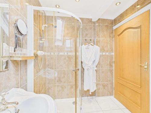 a bathroom with a shower and a sink at Spacious 3-Bed Home in North Cornwall | Walk to Wadebridge | Near Camel Trail, Padstow & Rock | Free Parking in Wadebridge