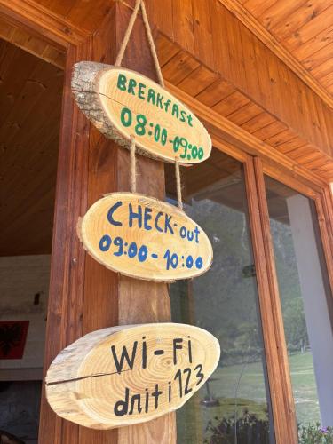 a sign that saysbeck out and waffle cut at Guesthouse Driti in Shkodër
