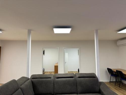 a living room with a couch and a table at Priestranny 3-izbovy apartman in Brenner