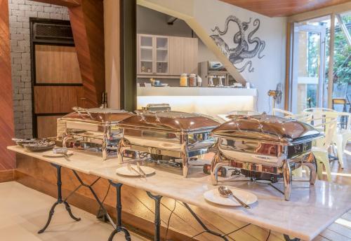 a group of four drums on a table in a kitchen at Sea Crest by Jomtien in Jomtien Beach