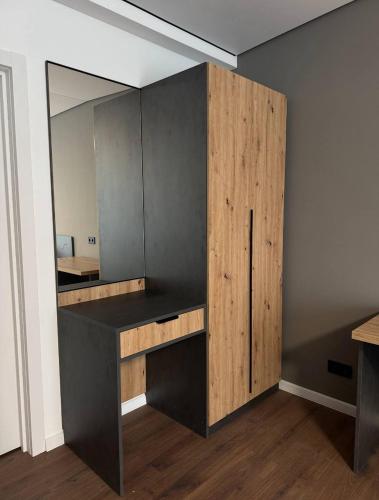 a room with a desk and a large mirror at Hotel Hostel Перехрестя in Chistilov