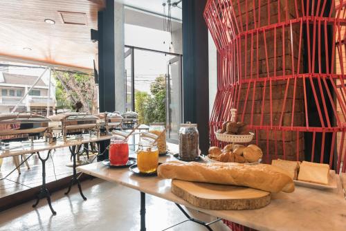 a table with bread and other foods on it at Sea Crest by Jomtien in Jomtien Beach