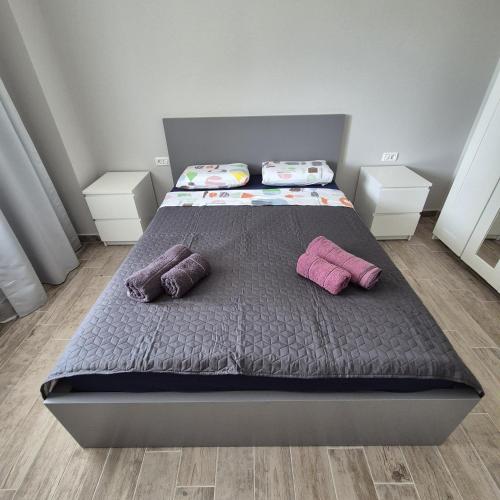 a bed with two pillows on it in a bedroom at Studio Palaz in Constanţa