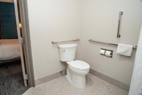 a bathroom with a toilet and two rolls of toilet paper at Holiday Inn Express Tucson-Airport by IHG in Tucson