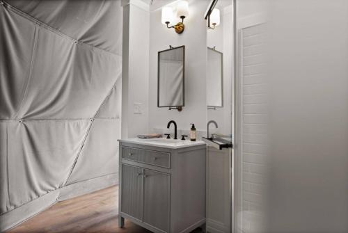 a bathroom with a sink and a mirror at "Cardinal Crest" - The Overlook LUX Dome - RRG in Stanton