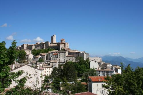 a town on top of a hill with houses at Casa Amrita B&B in Teramo