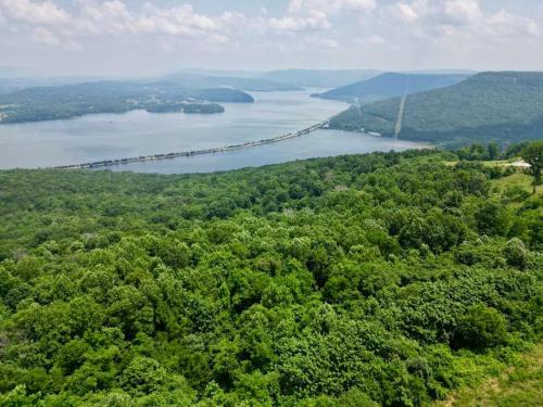 an aerial view of a river and a bridge at Hoot Owl with a private hot tub in Bryant
