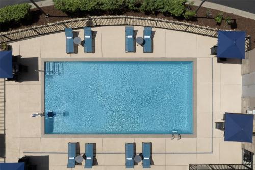 an overhead view of a swimming pool on a building at Home2 Suites by Hilton Huntsville Research Park Area, AL in Huntsville