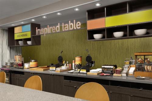 a prepared table in a fast food restaurant at Home2 Suites by Hilton Huntsville Research Park Area, AL in Huntsville