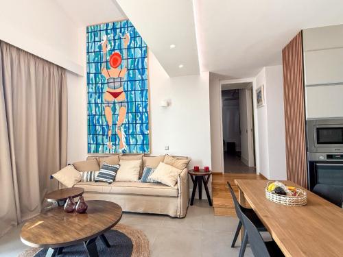 a living room with a couch and a stained glass window at Dimeli - Sea View Villas in Foinikounta in Finikounta