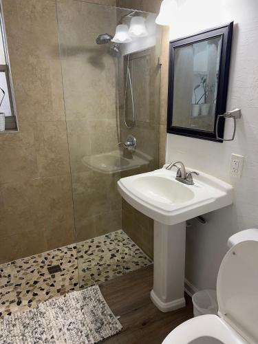 a bathroom with a sink and a shower and a toilet at 3 Bedrooms Florida Sunshine in Pompano Beach